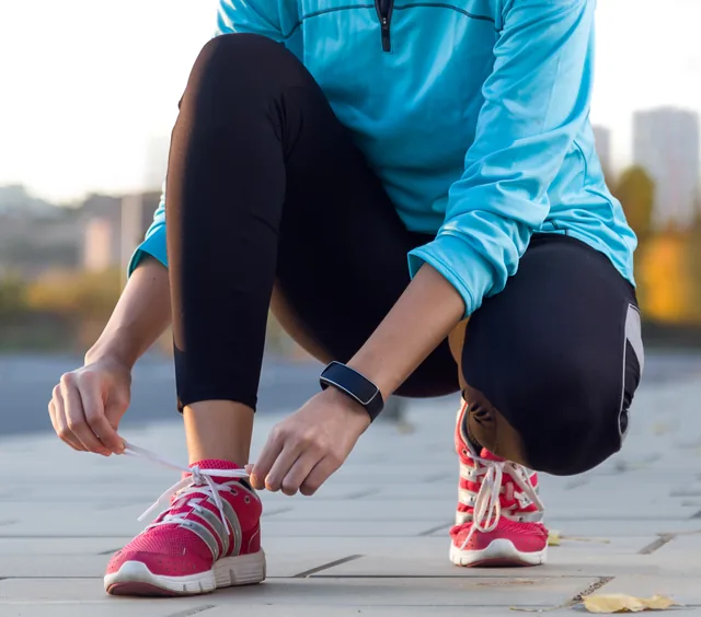 Tying shoelaces before heading out