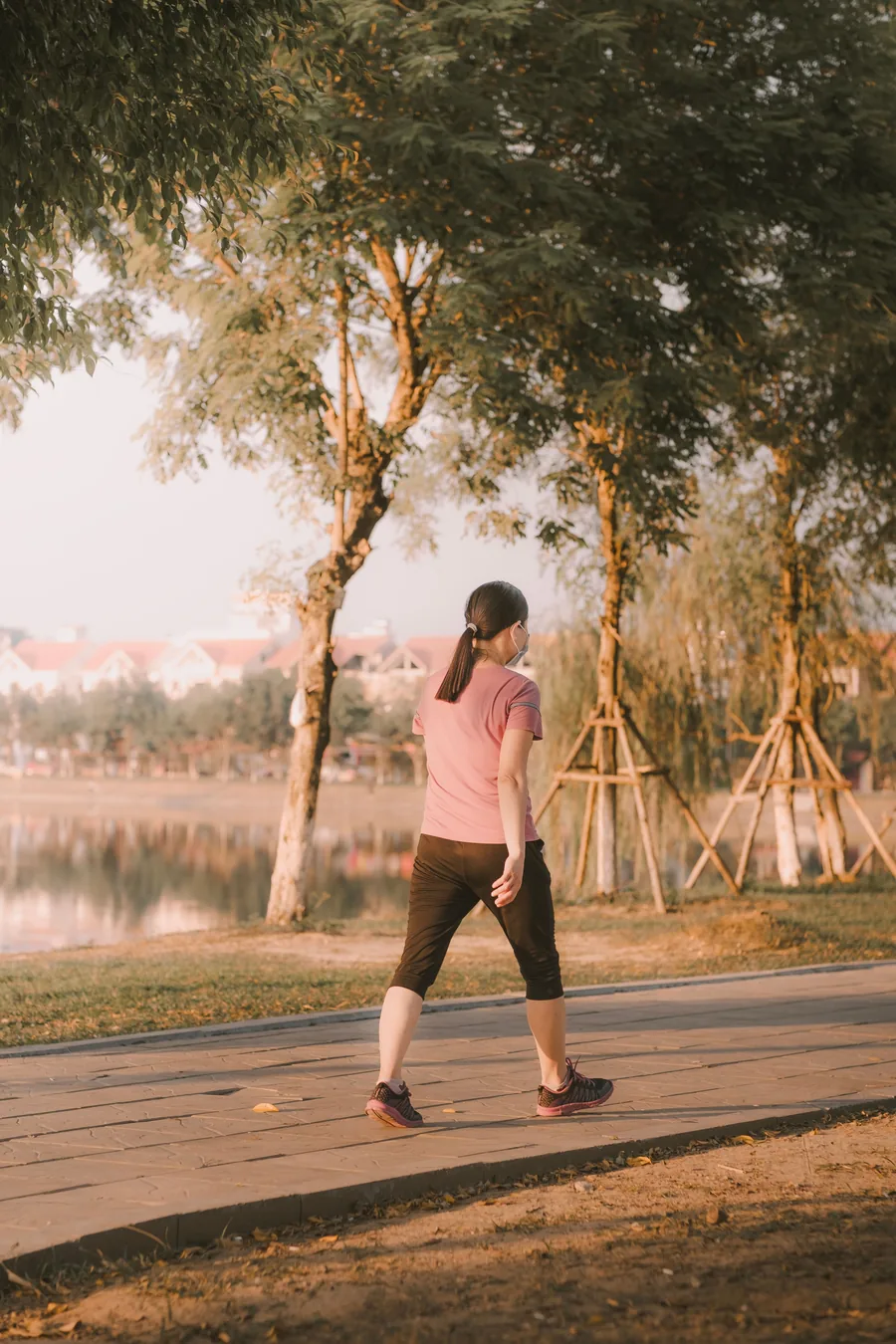 A person walking along a path after a meal